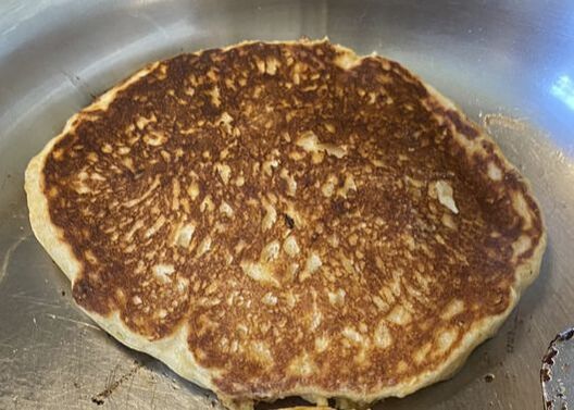 Fresh-cooked pancake in pan